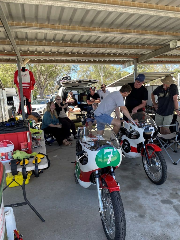 The pit garage with family and friends- Crew Chief James Mott and Jon Mitchell doing the checklist for the125 before race 2